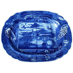 Antique English pottery blue and white platter with print of the Naval Night Battle early 19th century