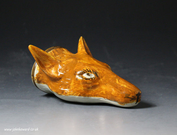 Antique English pottery fox head stirrup cup in pratt colours circa 1800