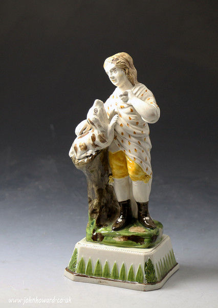 Antique English pottery prattware figure of a boy with dog .Staffordshire 
