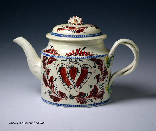 English creamware pottery teapot with heart motif and inscription c1775