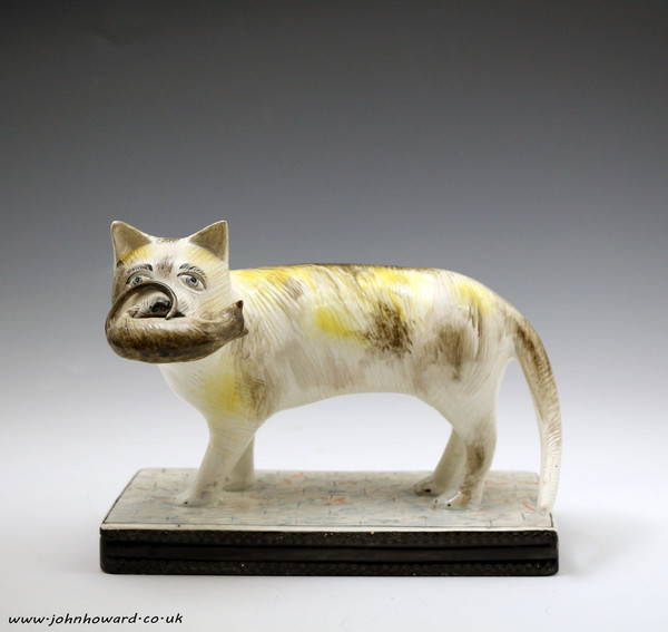 Staffordshire pottery figure of a cat with a mouse early 19th century Pearlware English