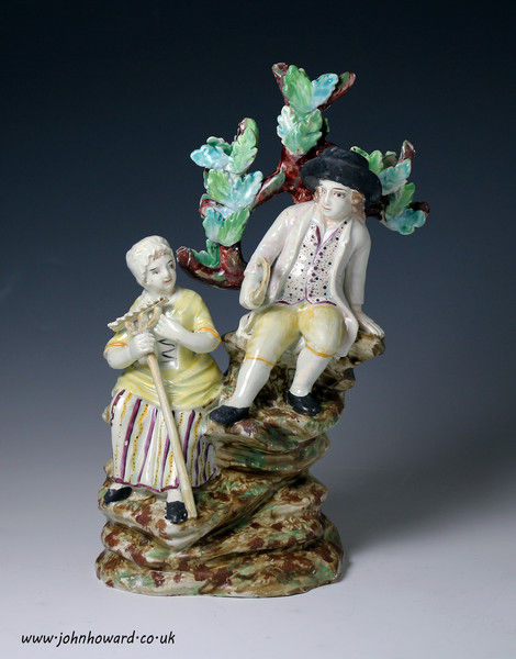 Staffordshire pottery pearlware figure group of a harvesting couple with bocage circa 1800