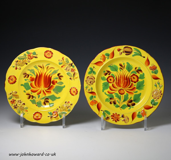 Two canary yellow pottery plates with bright enamels probably Staffordshire early 19thc
