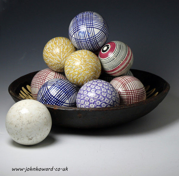 Collection of 13 pottery carpet balls mid 19th century Scottish or NE English production.