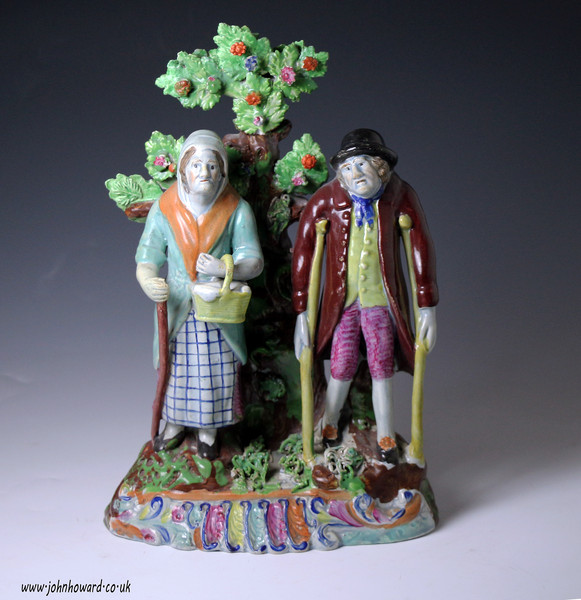 Antique Staffordshire pottery bocage figure of Old Age. English period early 19th century