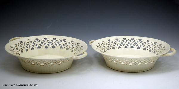 Pair of plain creamware baskets with reticulated borders, English pottery late 18th century