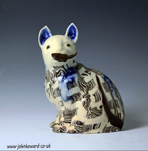 Staffordshire agateware pottery saltglaze figure of a cat mid 18th century English.