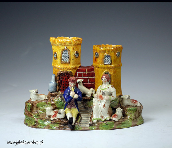 Antique Staffordshire pottery pearlware figure group of musical shepherds with dog and flock.c1820