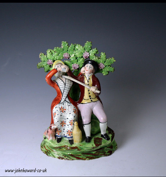 Staffordshire pottery figure group of a 