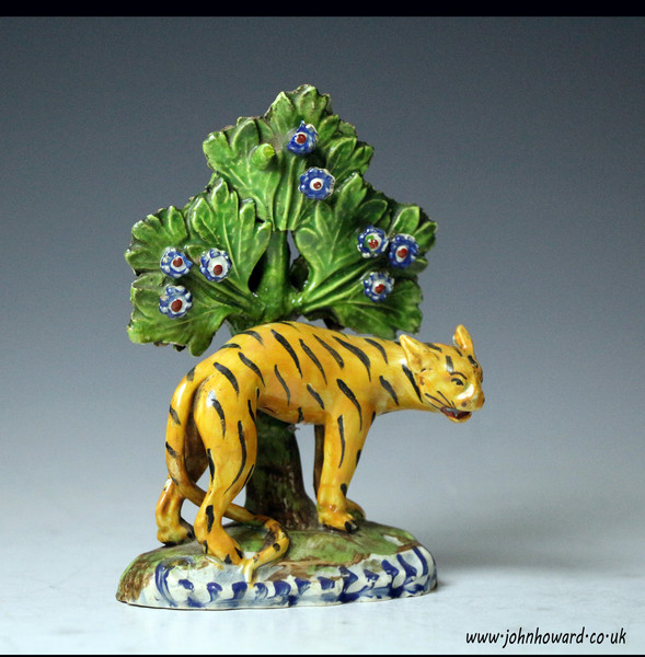 Staffordshire pottery pearlware figure of a tiger with bocage early 19th century English