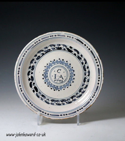 English delftware plate initialed CIA and dated 1738. Probably Bristol 
