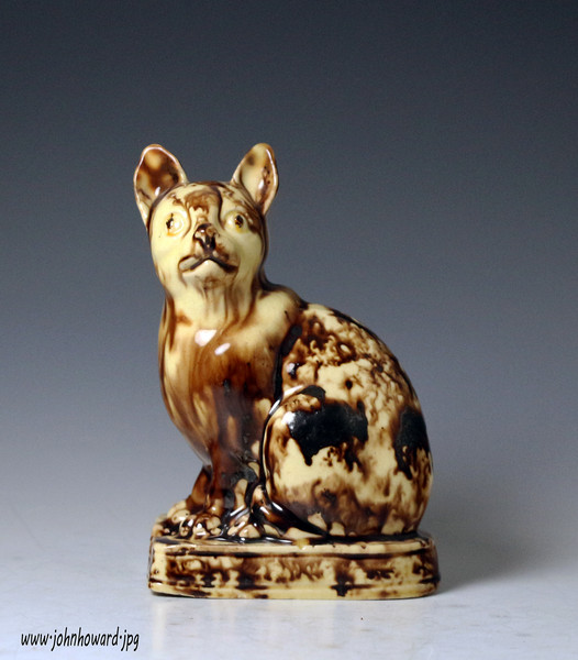 Whieldon type figure of a seated cat lead glazed creamware pottery,Staffordshire England c1770 antique period.