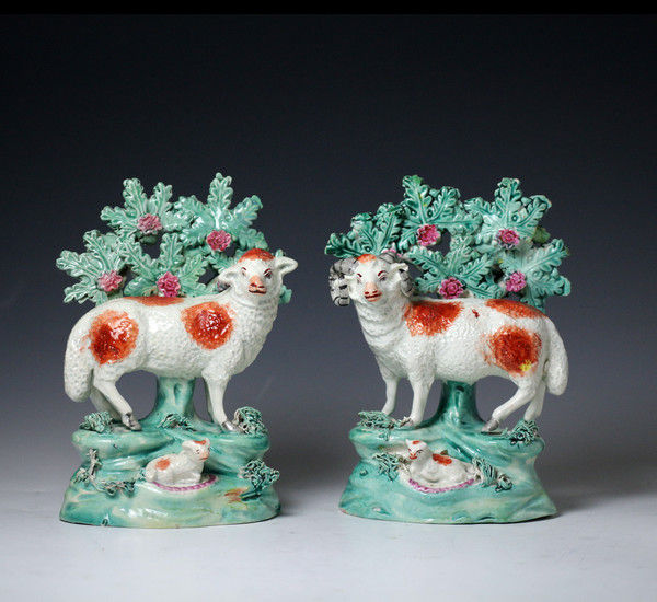 Antique Staffordshire pottery pearlware pair of sheep and ram figures with bocage early 19th century.