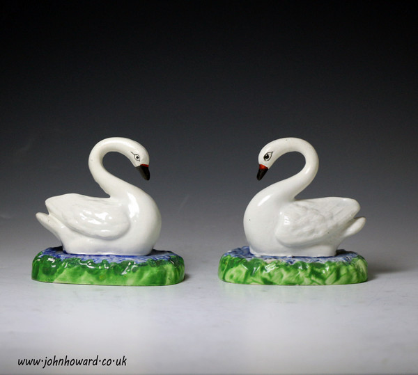Antique Staffordshire pottery pearlware figures of swimming swans c1830
