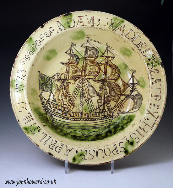 Large Scottish earthenware  dish scraffito decorated with a fully rigged sailing,the rim named and dated 1773 Adam Waddel and Beatrex Willson 