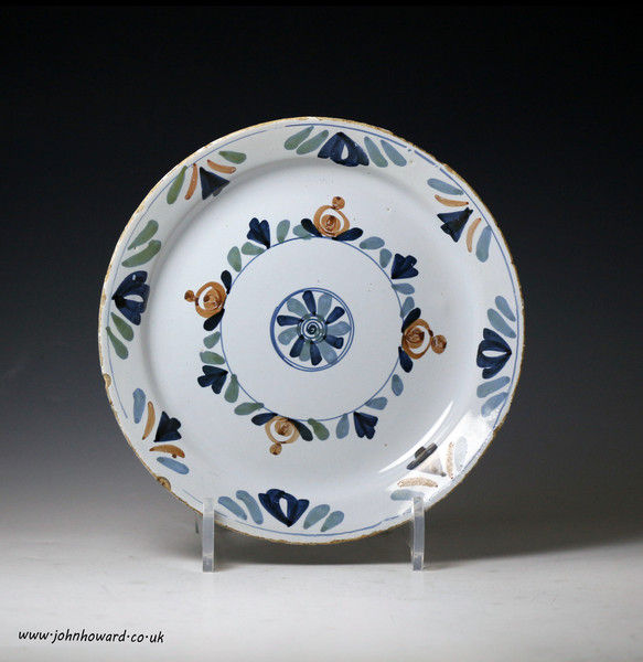 Antique English poly-chrome decorated delft ware pancake shape plate mid 18th century 