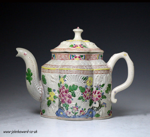 Saltglaze stoneware relief moulded pectin shaped teapot with enamel decoration Staffordshire 18th century
