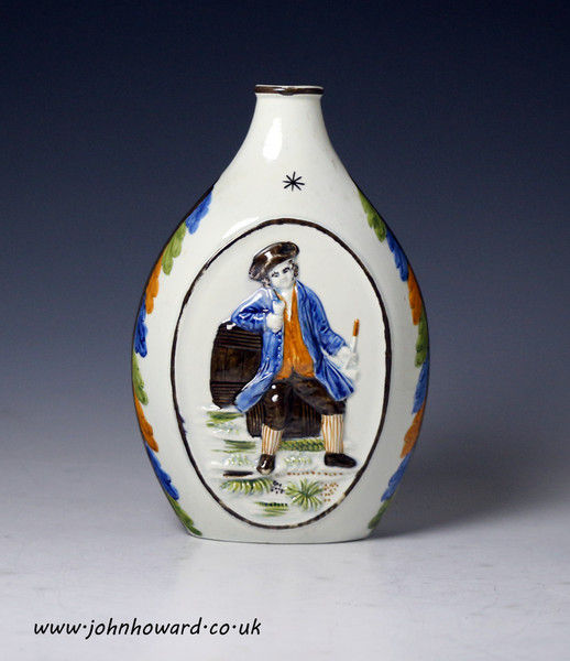 Antique English prattware pottery spirit flask with tavern figures modelled in relief c1810