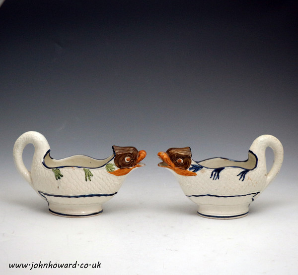 Two English pottery prattware dolphin figure sauce boats. Antique period early 19th century