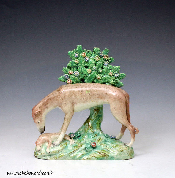 Antique Staffordshire pottery bocage figure of a Greyhound. English  early 19th century