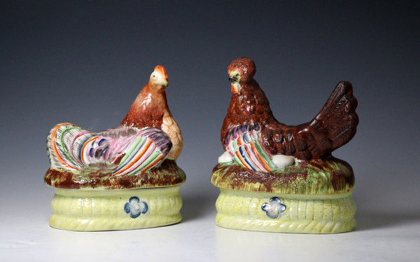Pair of Staffordshire pottery pearlware  hens seated on baskets.