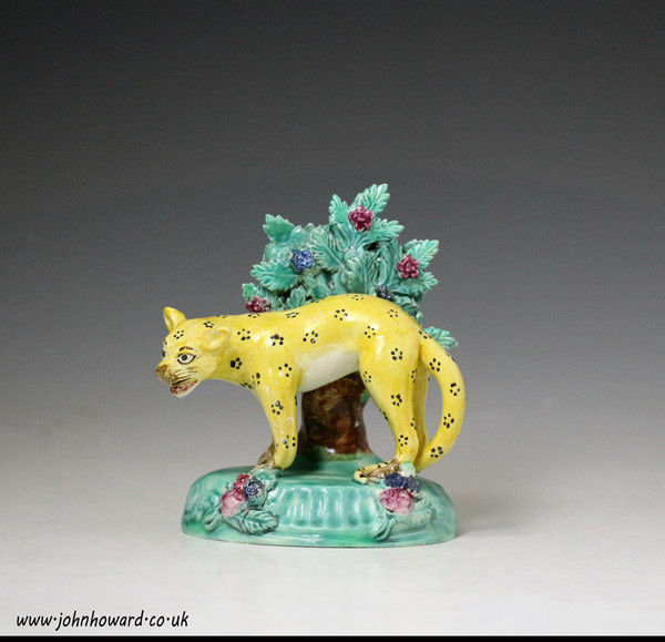Antique Staffordshire pottery figure of a leopard with bocage in pearlware attributed  to SHerratt. early 19thc.