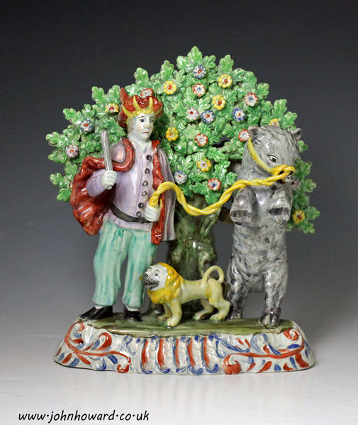 Staffordshire pottery pearlware  bocage figure group of a troubador with lion and bear