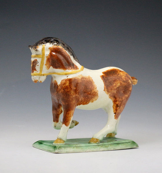 Staffordshire pottery figure of a Suffolk Punch horse c1780