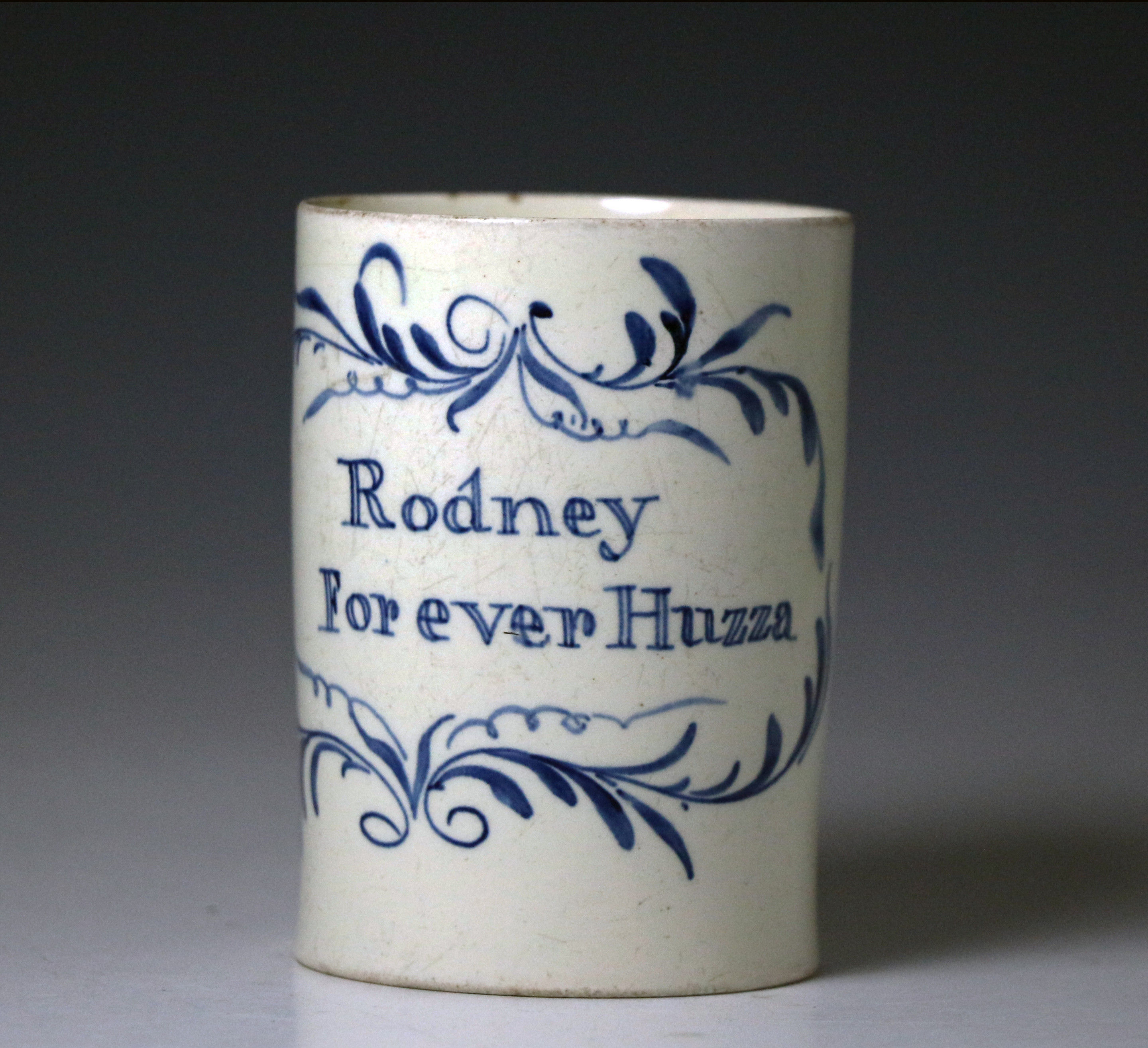 English creamware pottery tankard with the inscription  