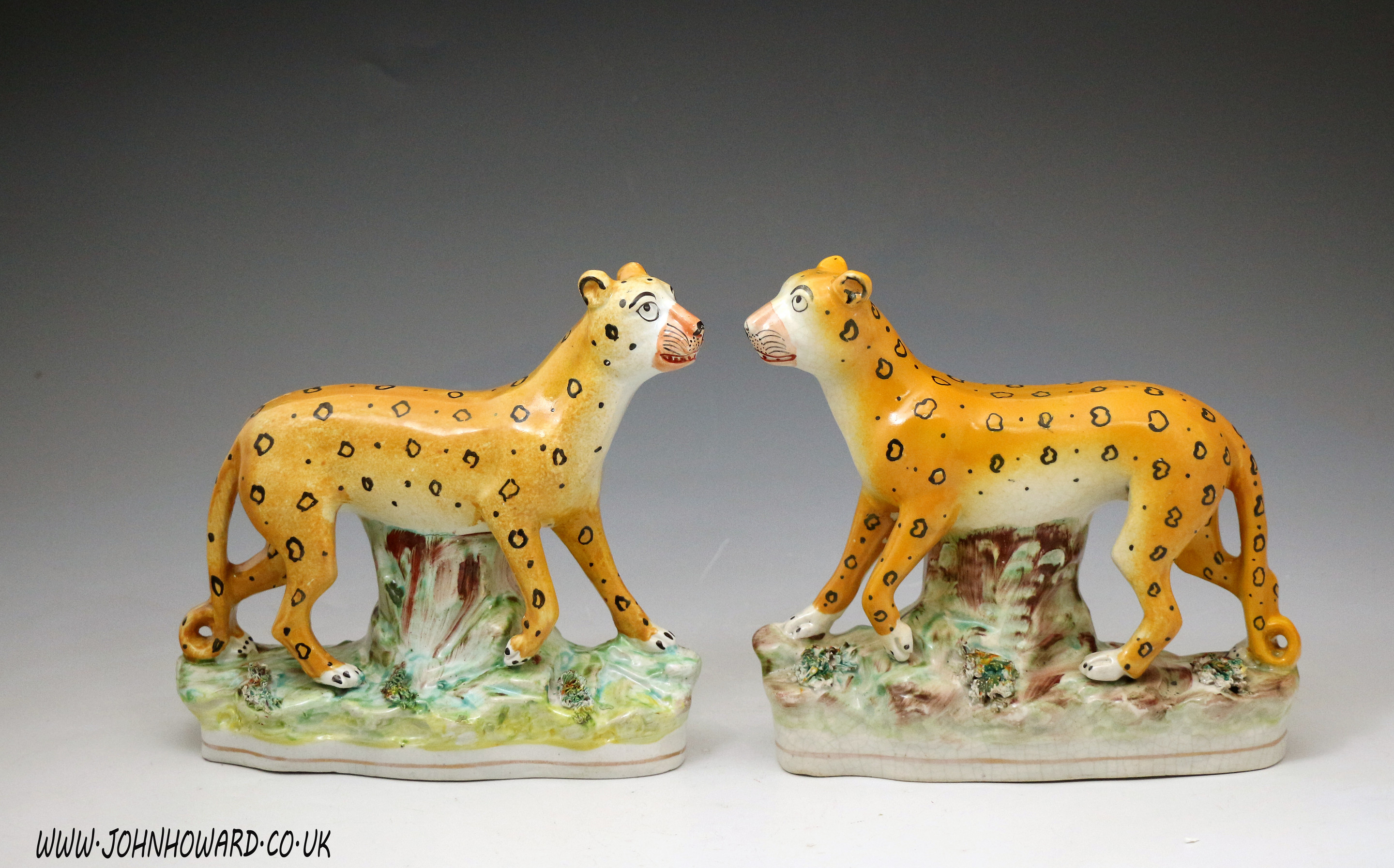Antique Staffordshire pottery figures of standing leopards, English mid 19th century 