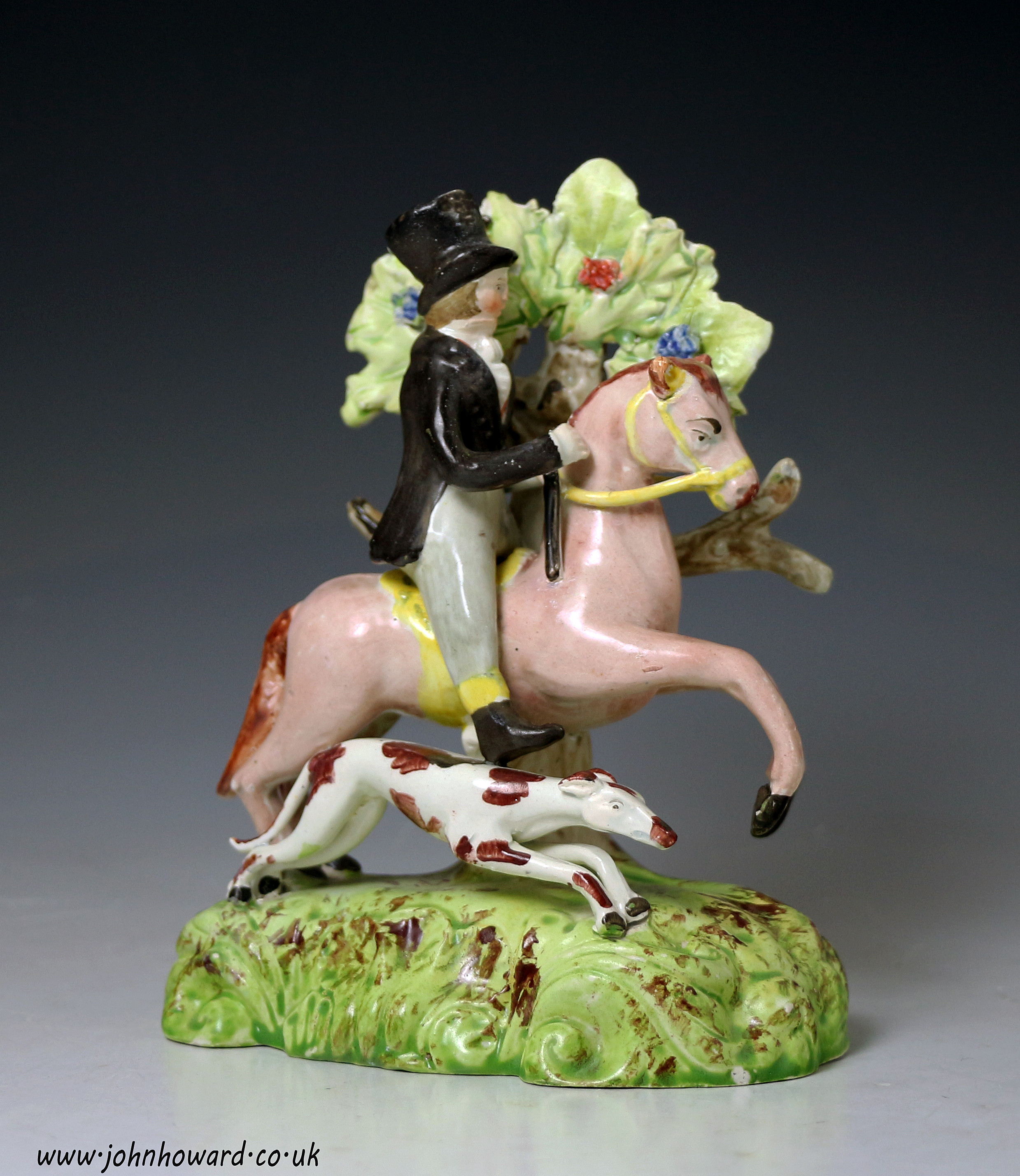 Antique Staffordshire pottery pearlware bocage figure of a male equestrian with his dog. Early 19th century English
