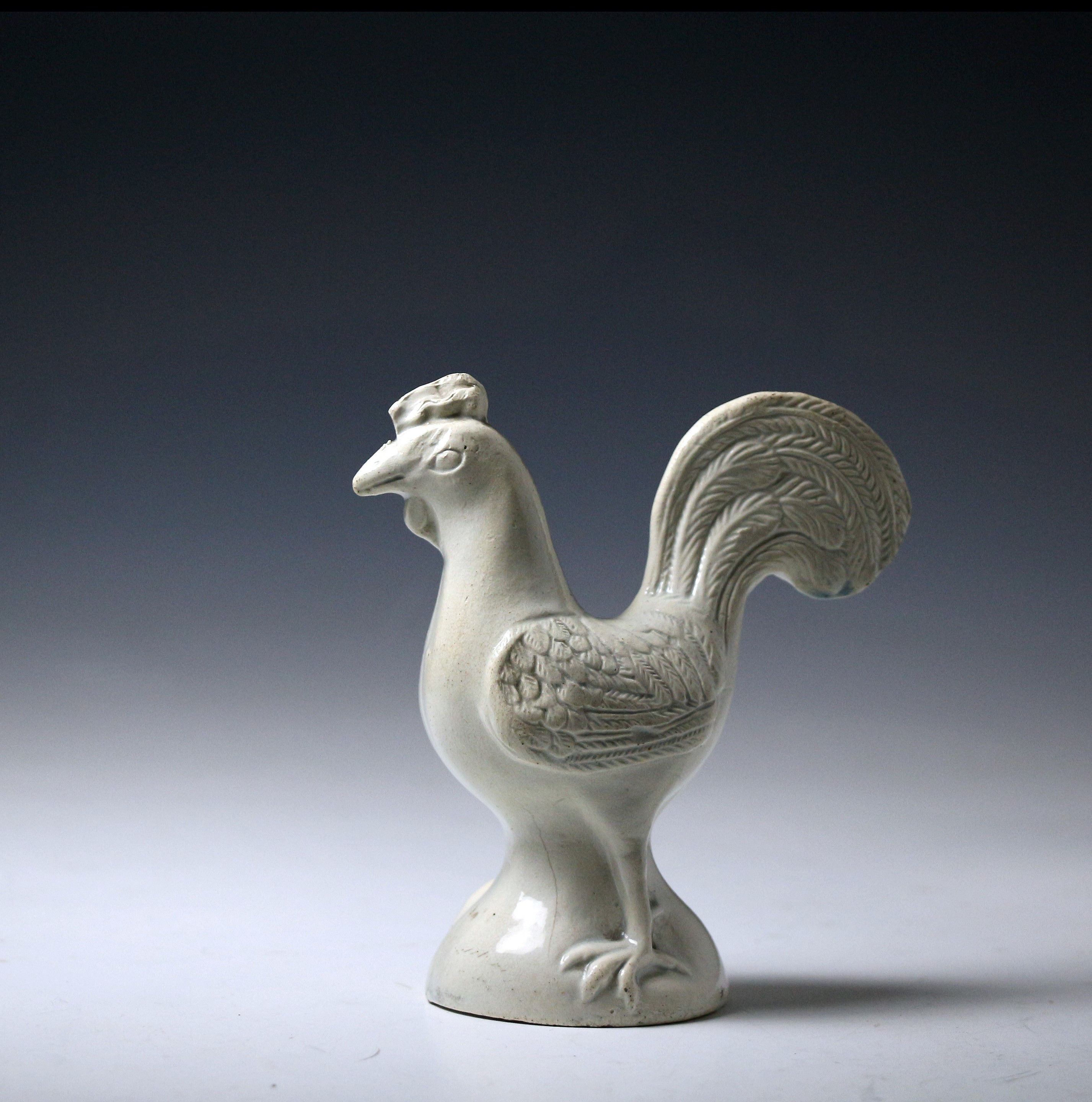 Early Staffordshire pottery saltglaze figure of a standing rooster mid 18th century England
