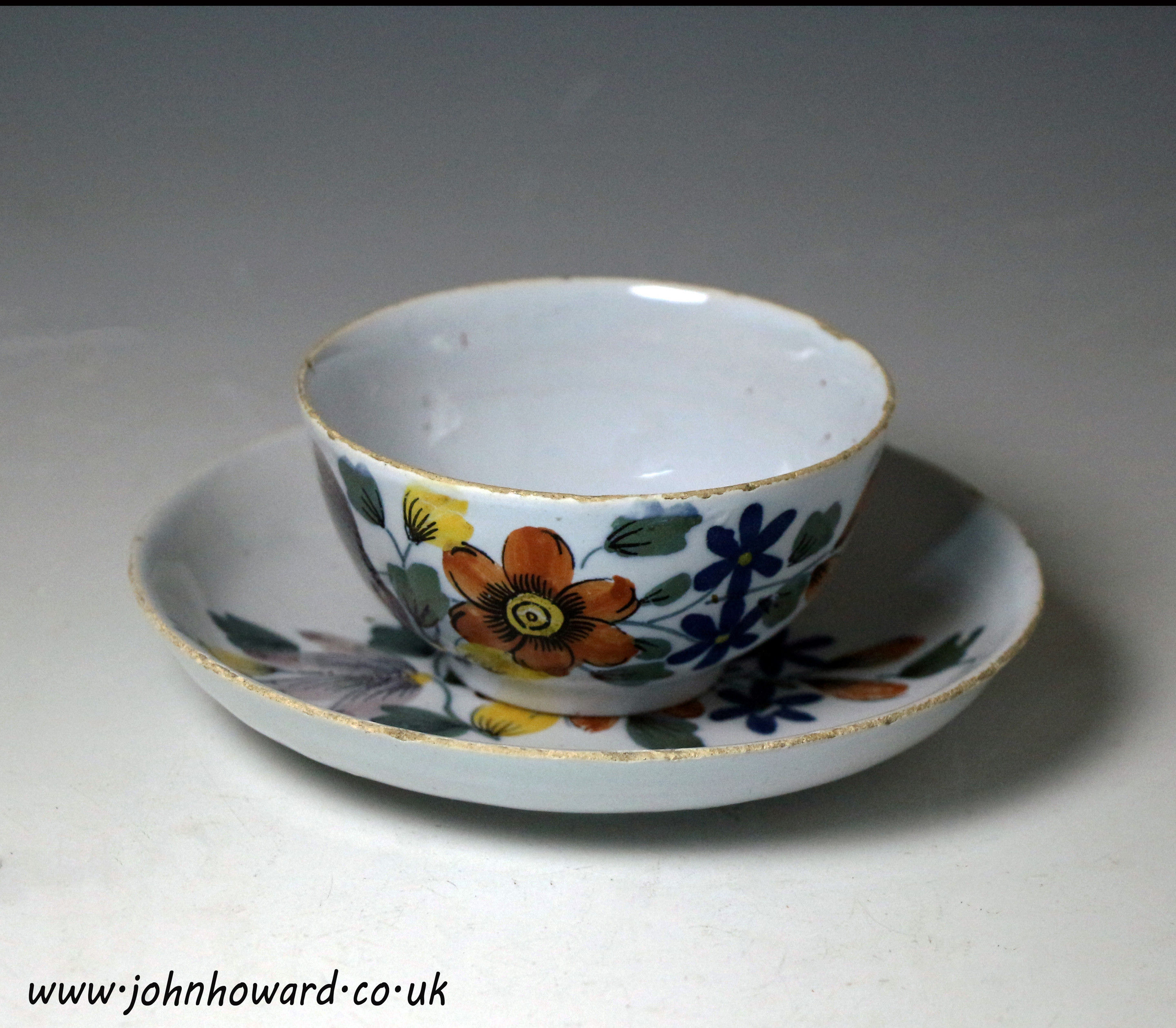 Delftware pottery  polychrome decorated tea bowl and saucer .Liverpool delftworks mid 18th century