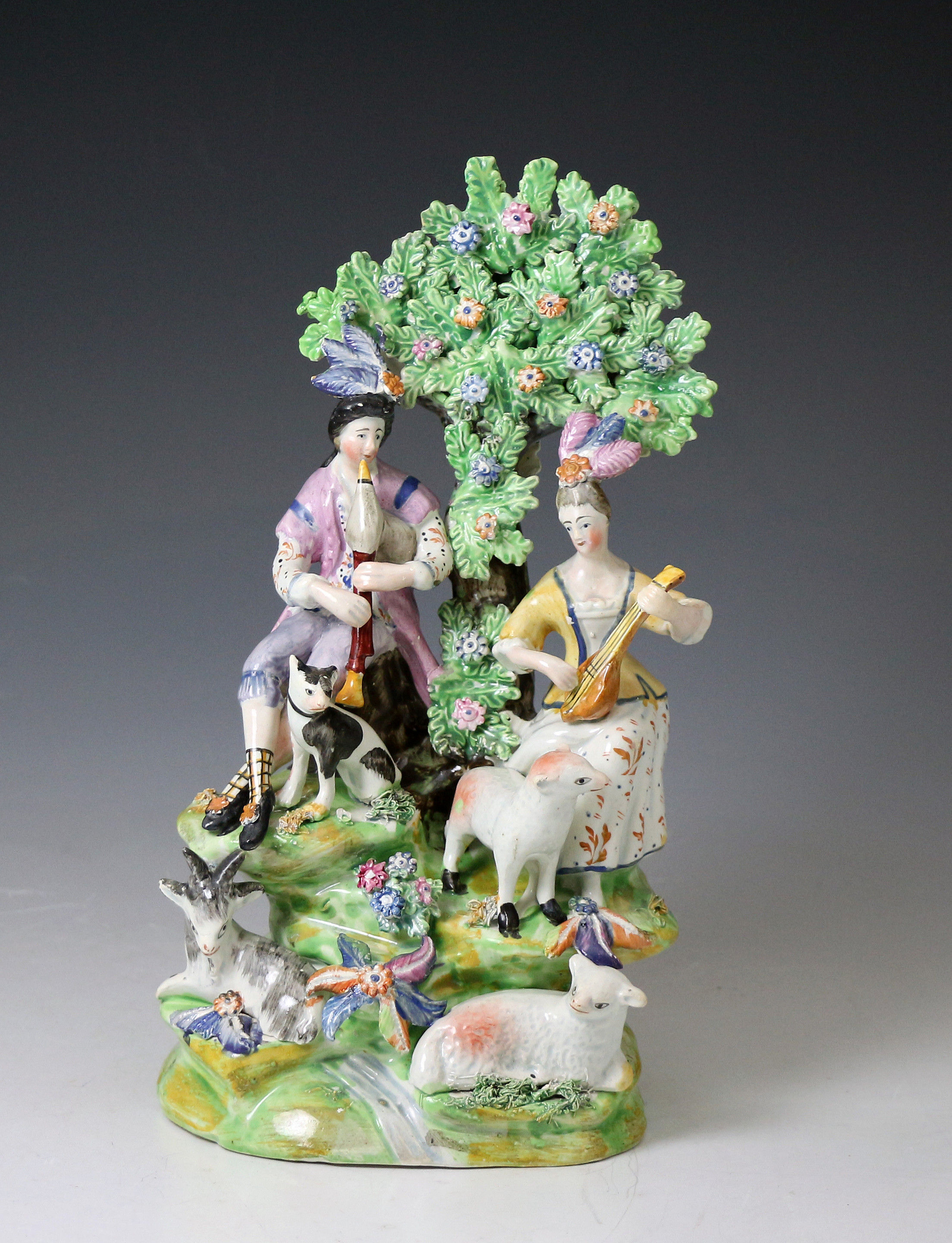 Staffordshire pottery bocage pearlware  figure group of Musical Shepherds wit