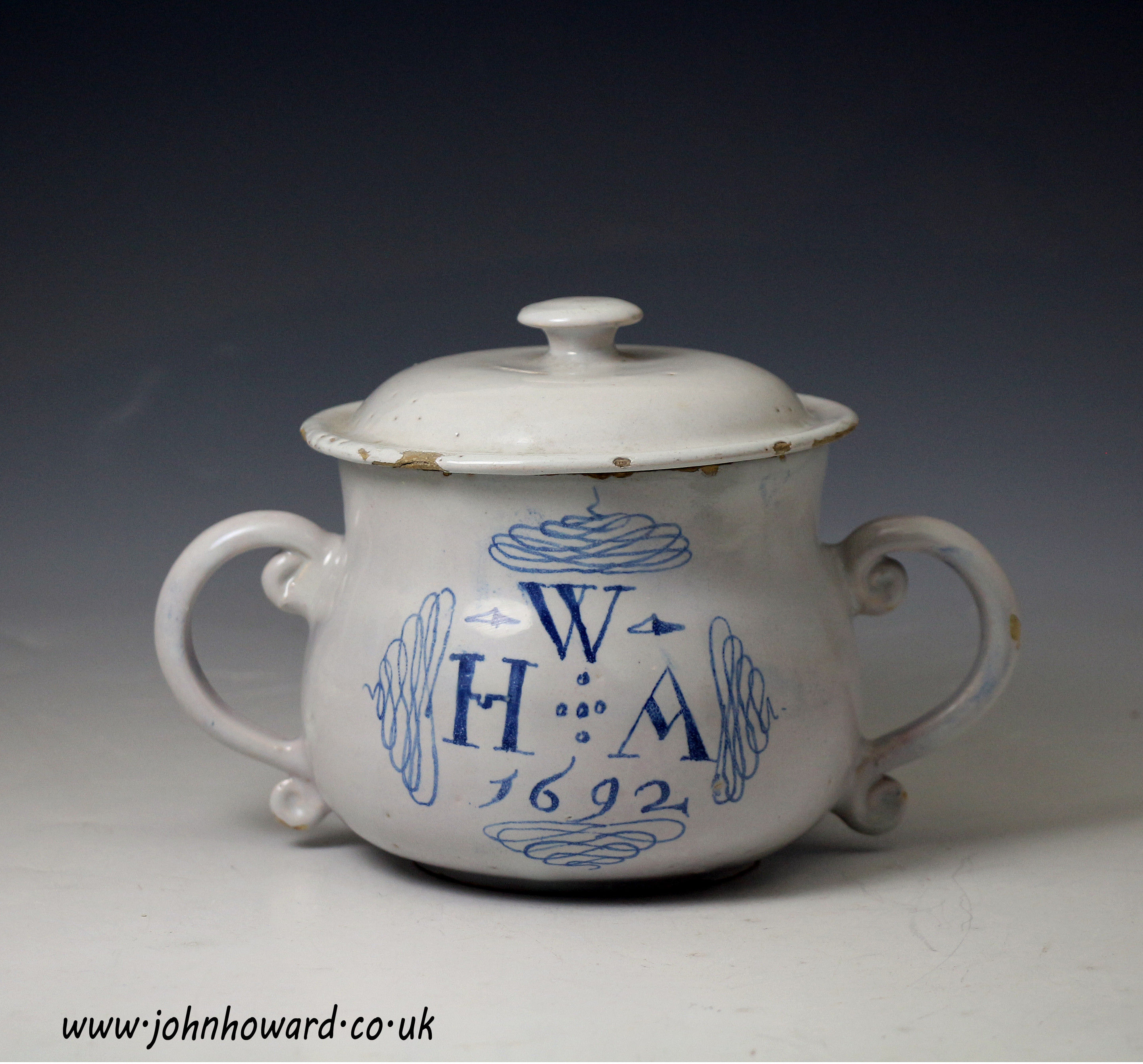 Early English London delftware two handled cup and cover dated 1692 and initialled W.H.A 
