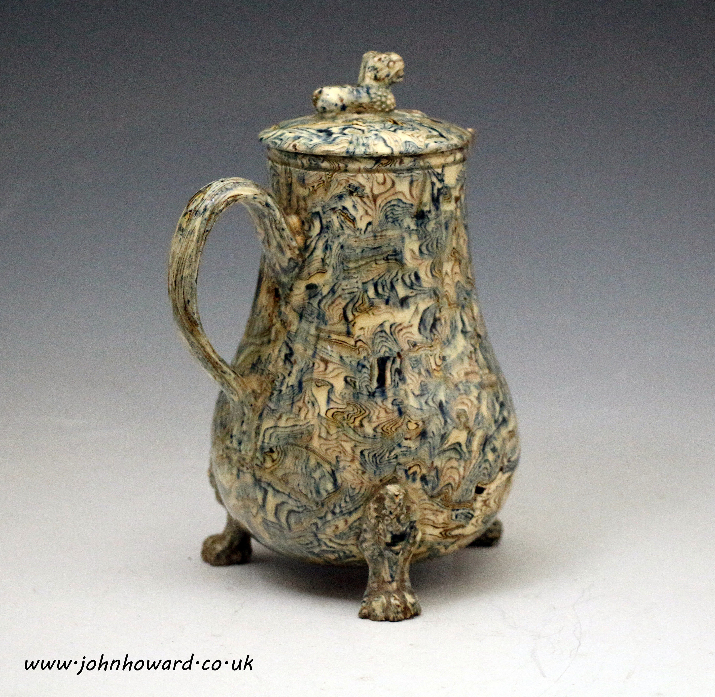 Staffordshire pottery pitcher with cover is solid agateware mid 18th century England