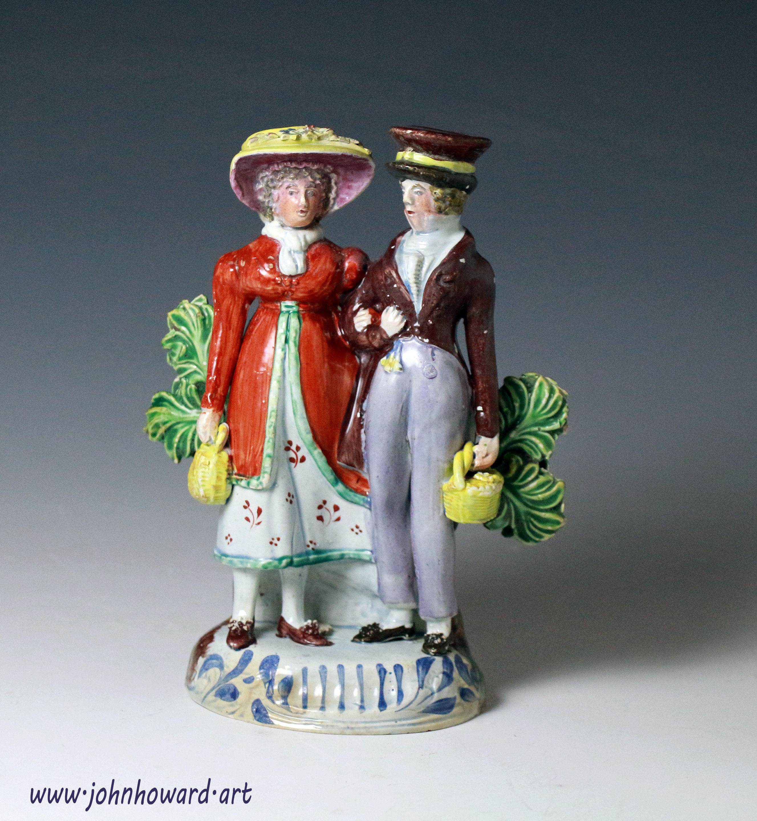 Antique pottery figure of the Dandies Staffordshire England early 19th century.