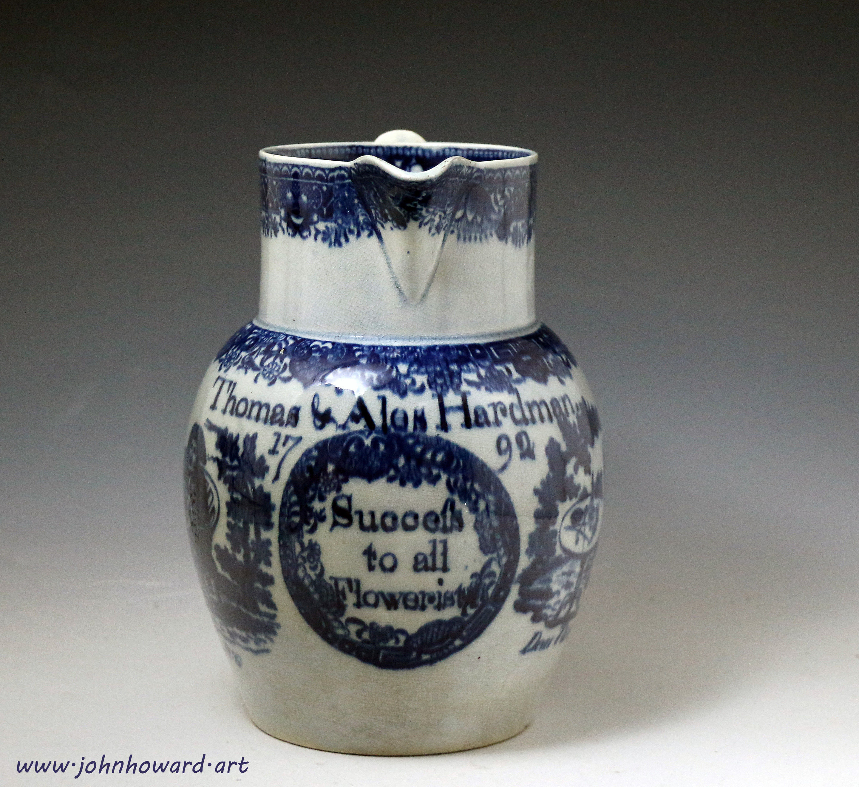 Antique pottery pitcher in blue and white transfer 