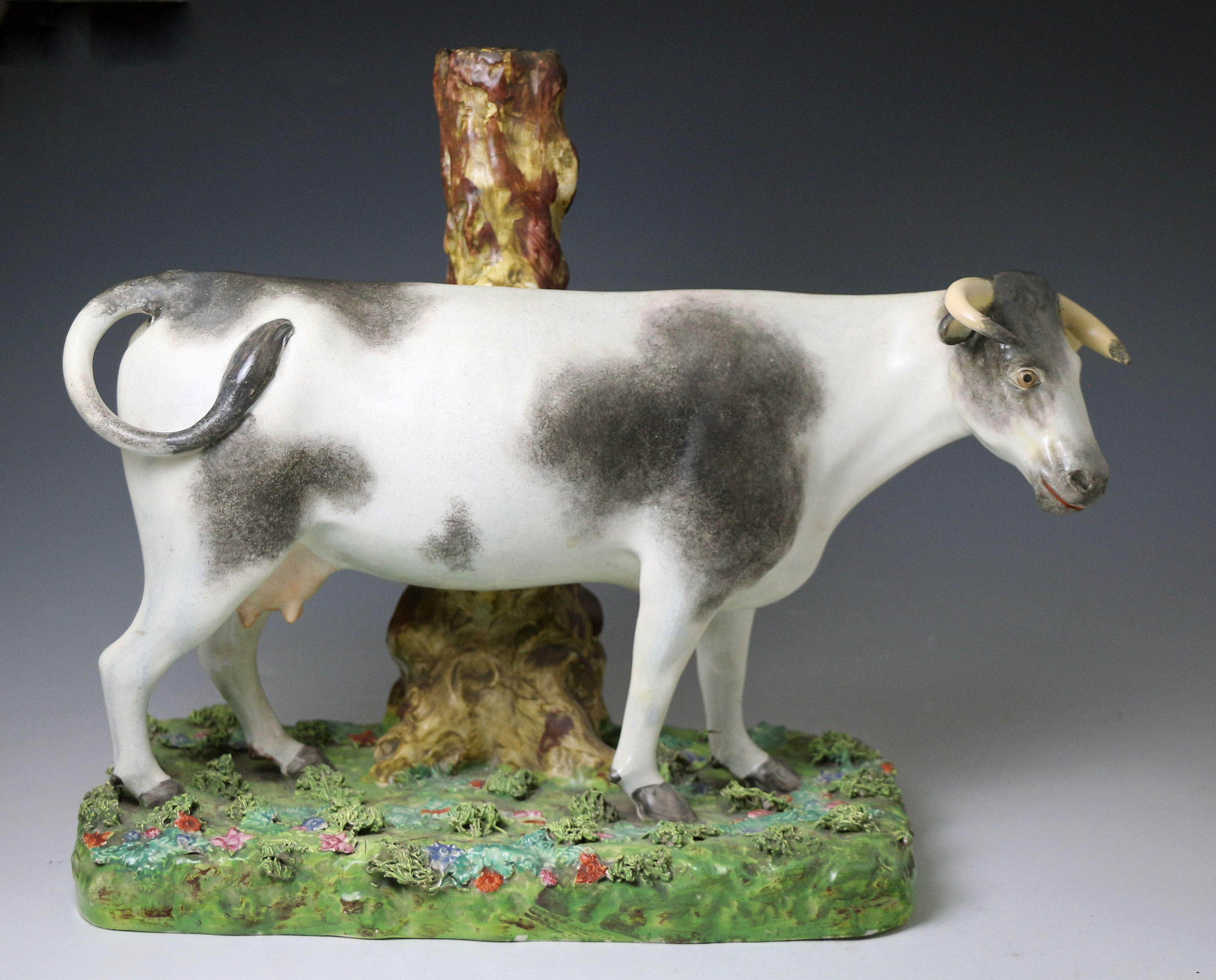 Antique Staffordshire pearlware pottery large scale figure of a cow on base 1815 period English