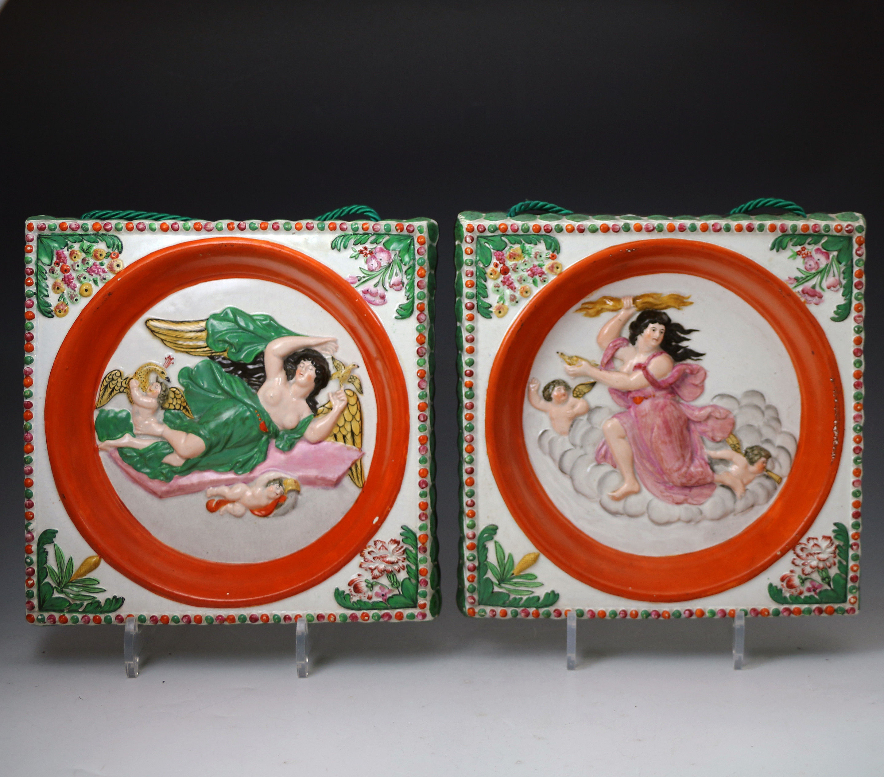 Pair of pottery pearlware plaques relief moulded with figures symbolic of night and day. Staffordshire early 19th century English