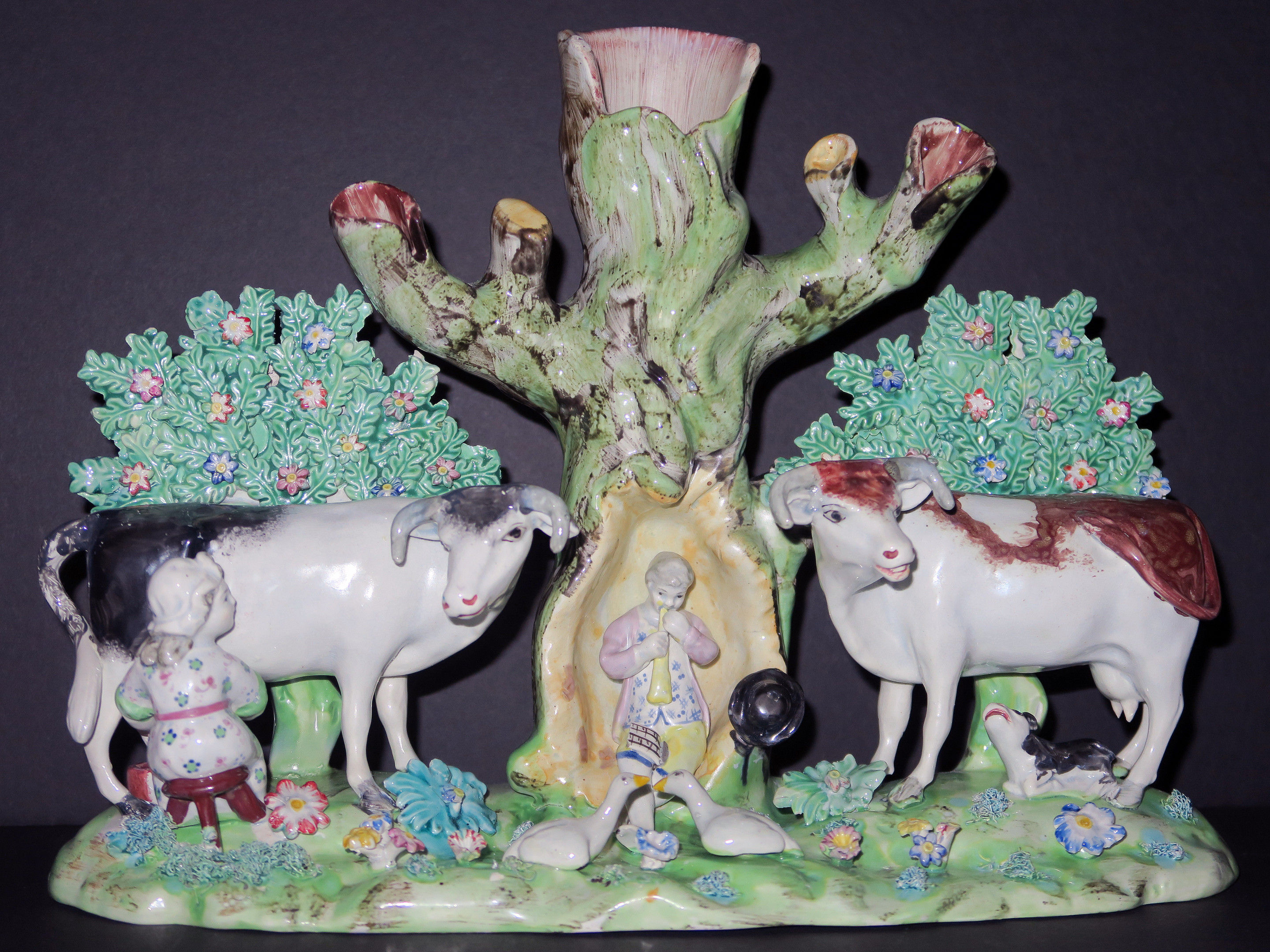 Rare Staffordshire pearlware pottery bocage figure group of cows and attendents, early 19th century.