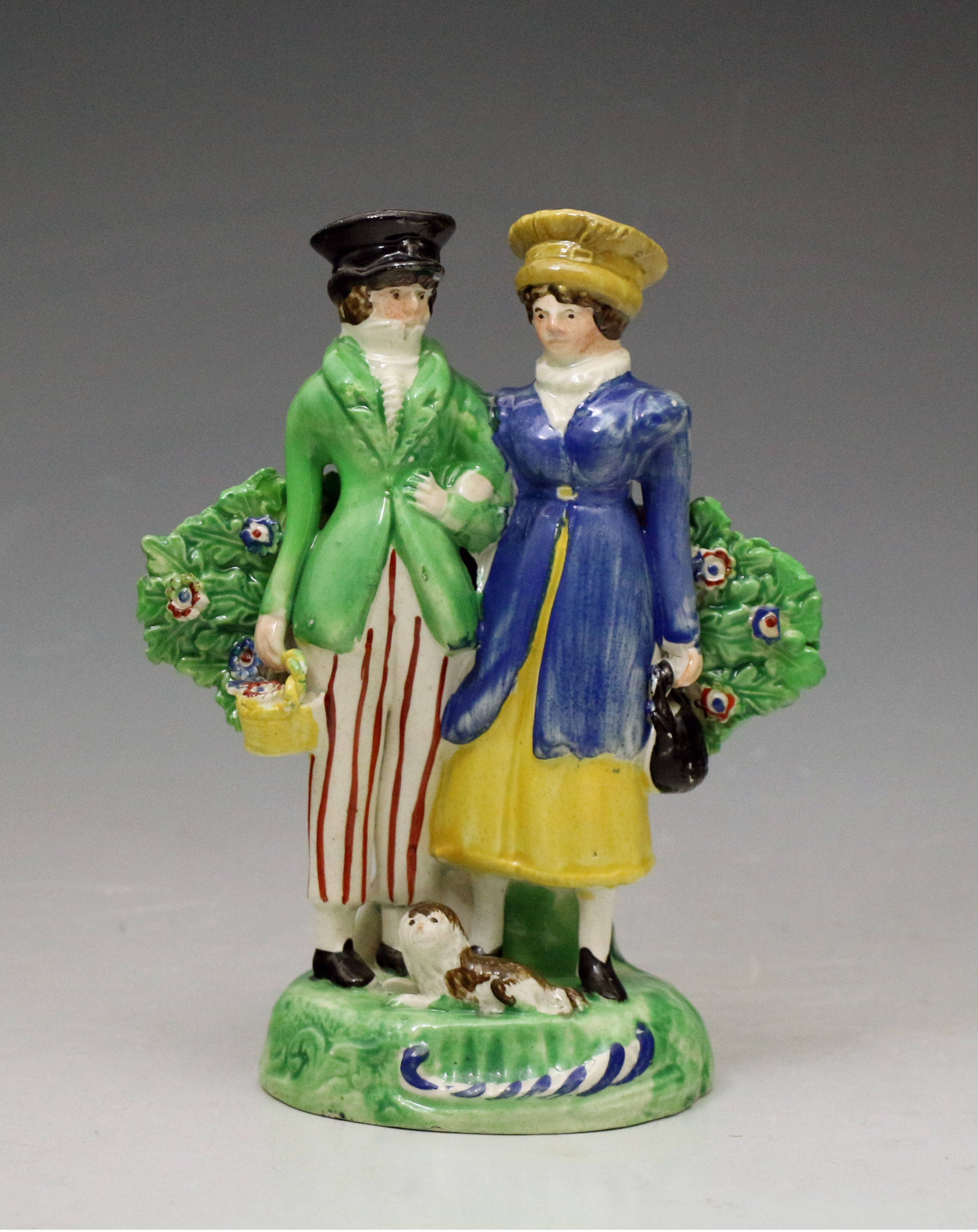 Staffordshire pearlware pottery Dandies figure group with bocage early 19thc