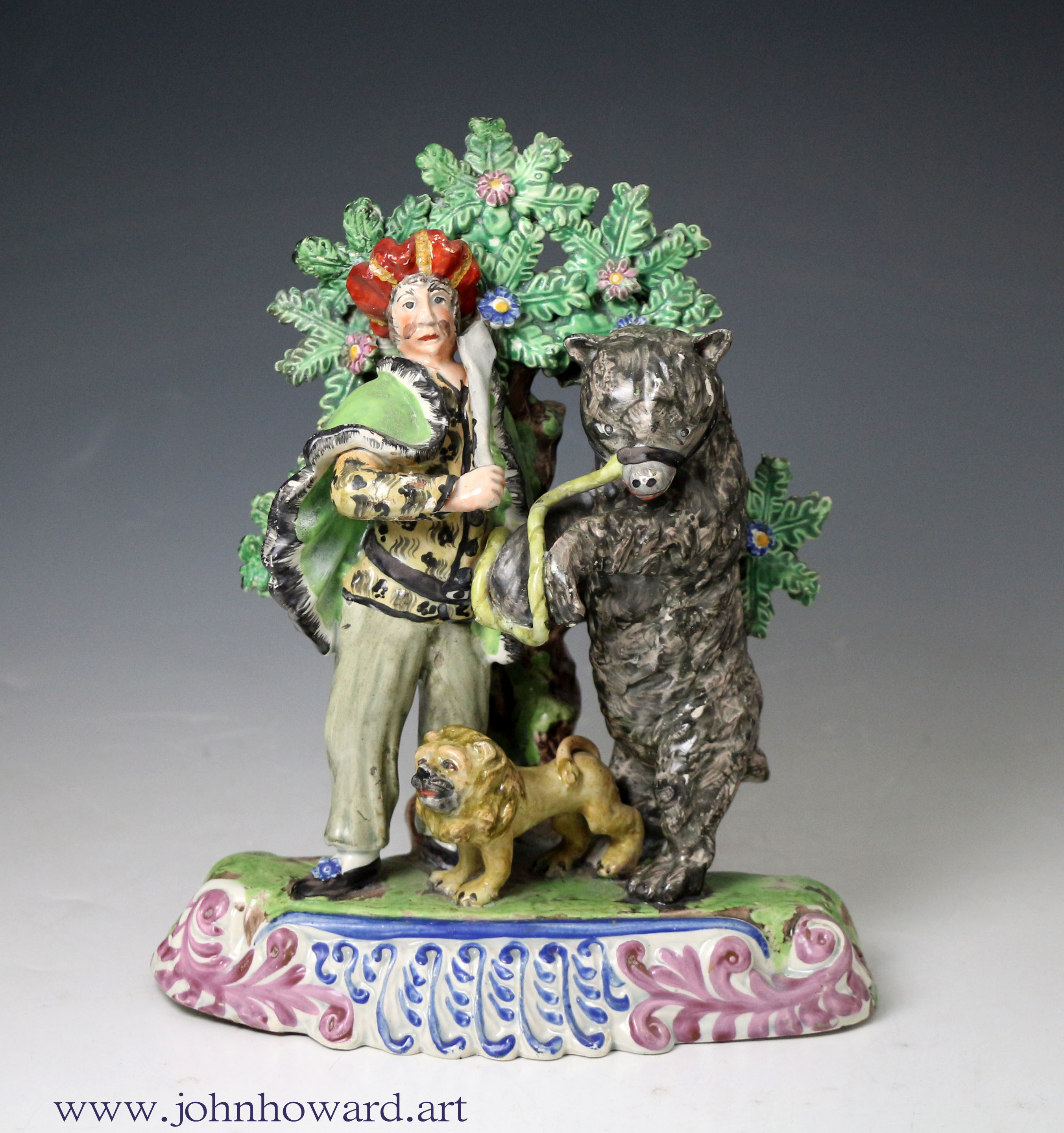 Staffordshire pottery figure group of a Savoyard with bear and lion circa 1820 antique period English.