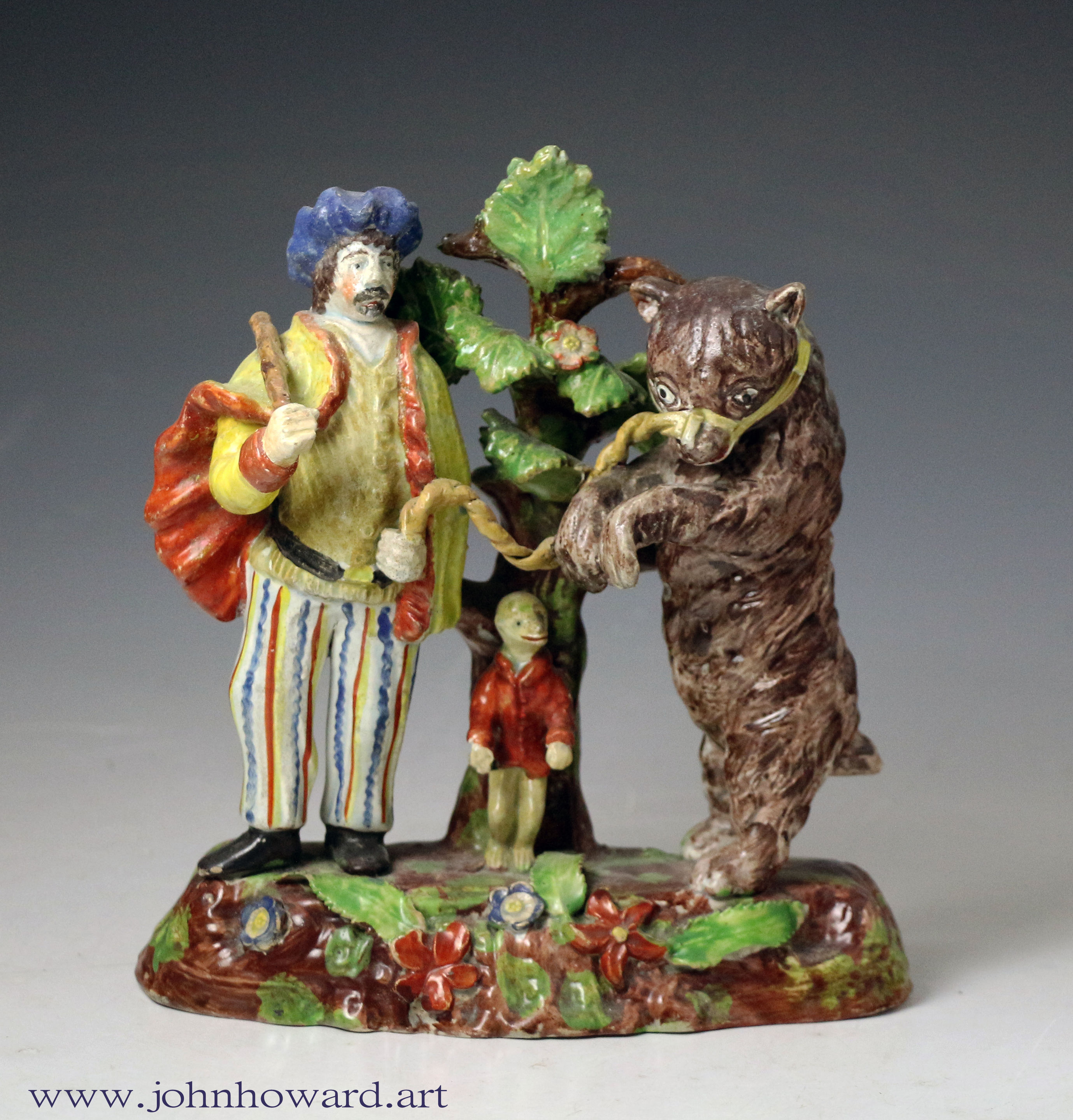 Staffordshire pottery bocage figure group of a Savoyard with bear and monkey early 19th century