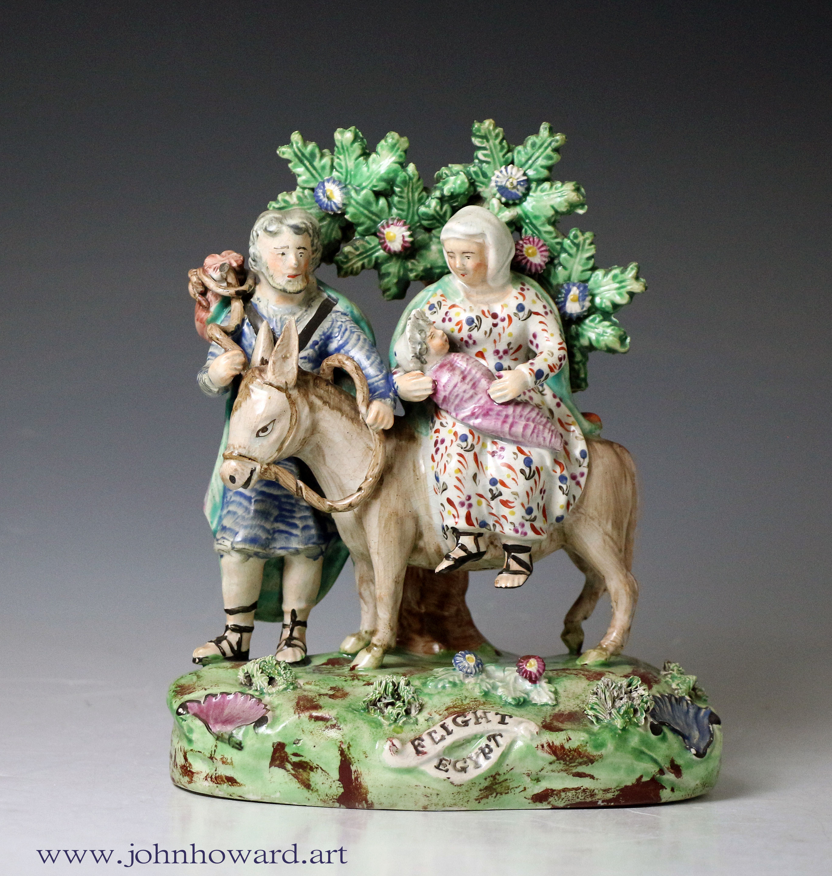 Staffordshire pottery bocage figure group Flight to Egypt, marked Walton.