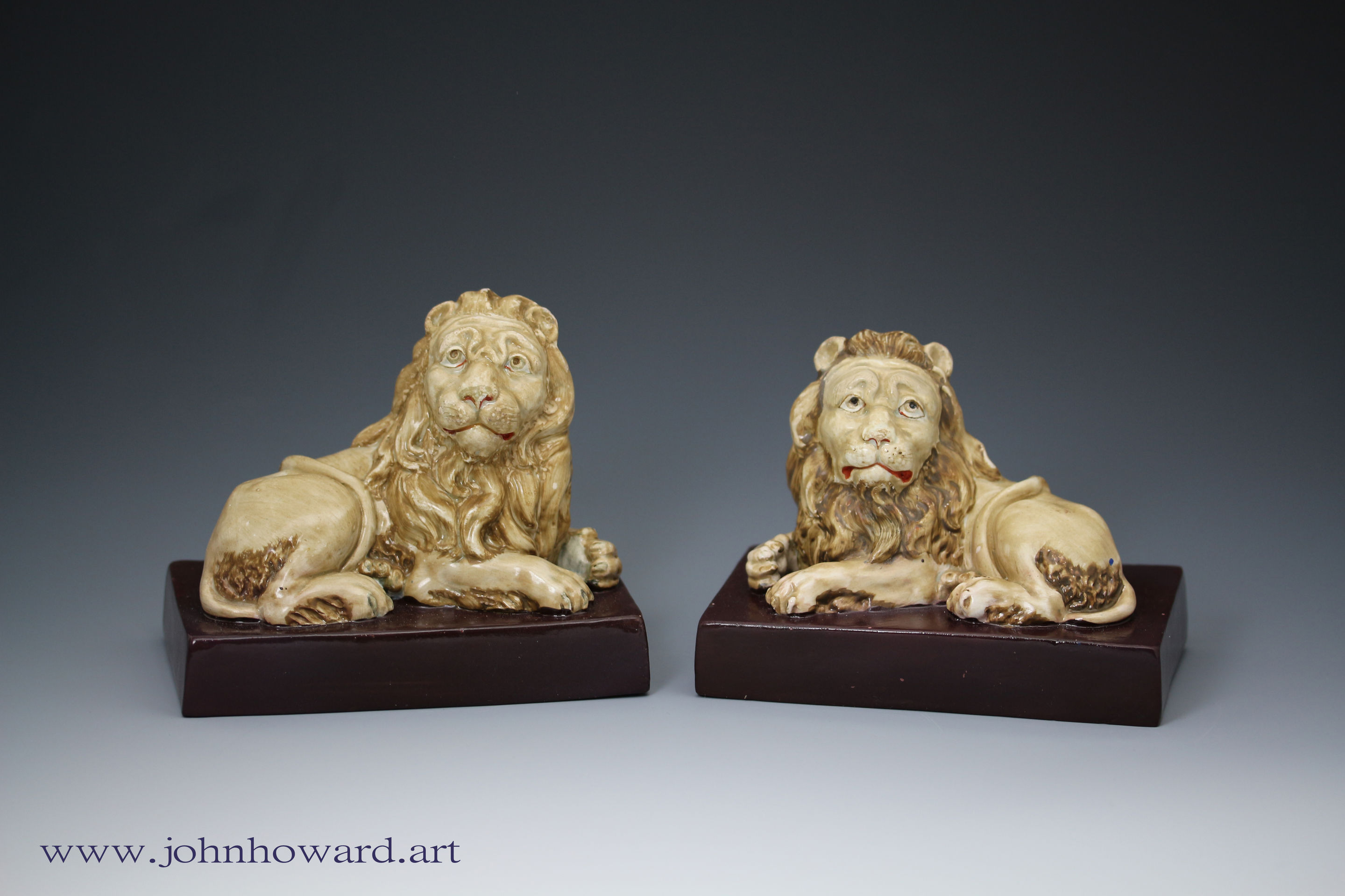Staffordshire pottery pair of lions by Wood and Caldwell early 19th century England