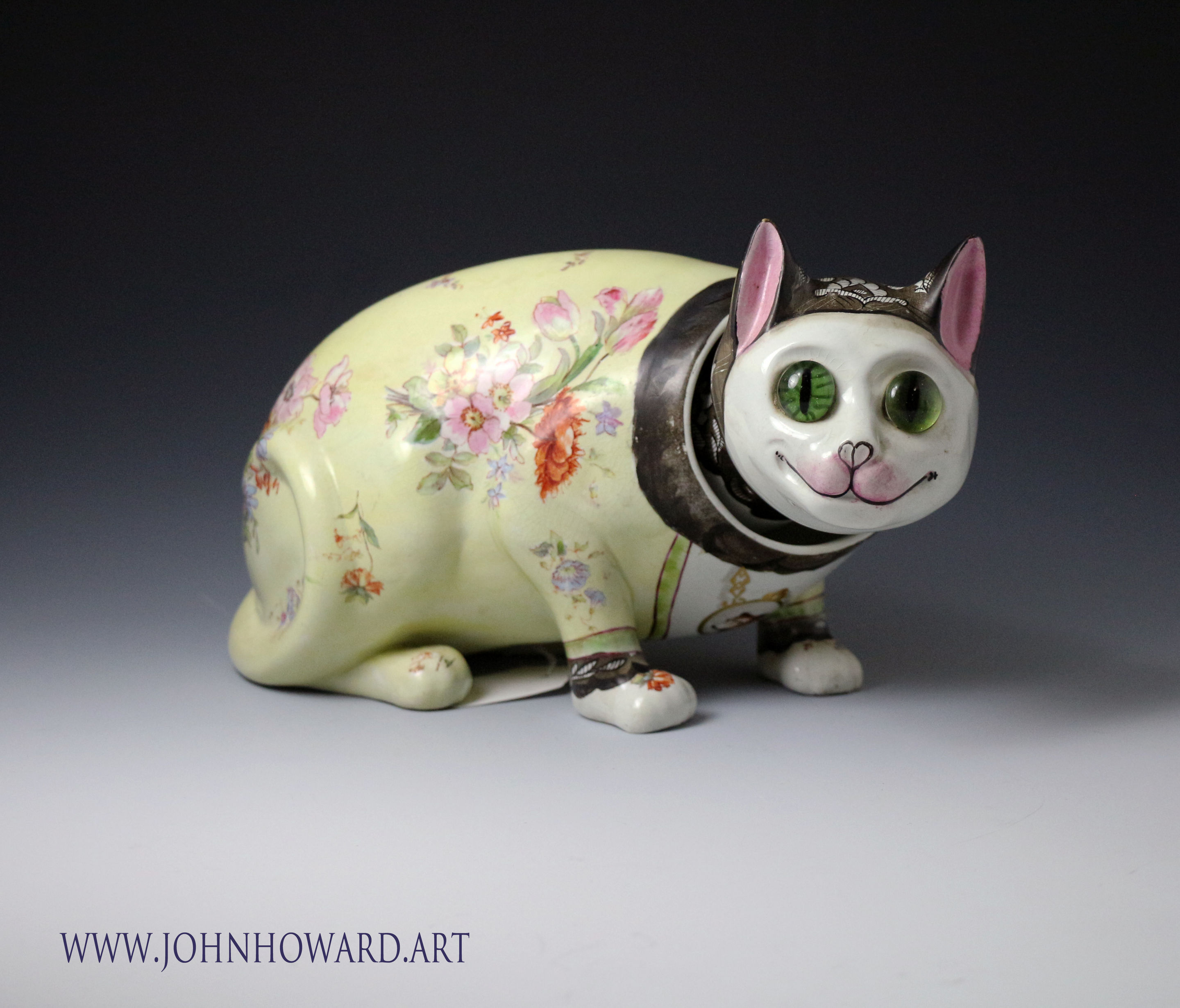 Galle style pottery nodding cat with glass eyes, a rare figure dating circa 1900