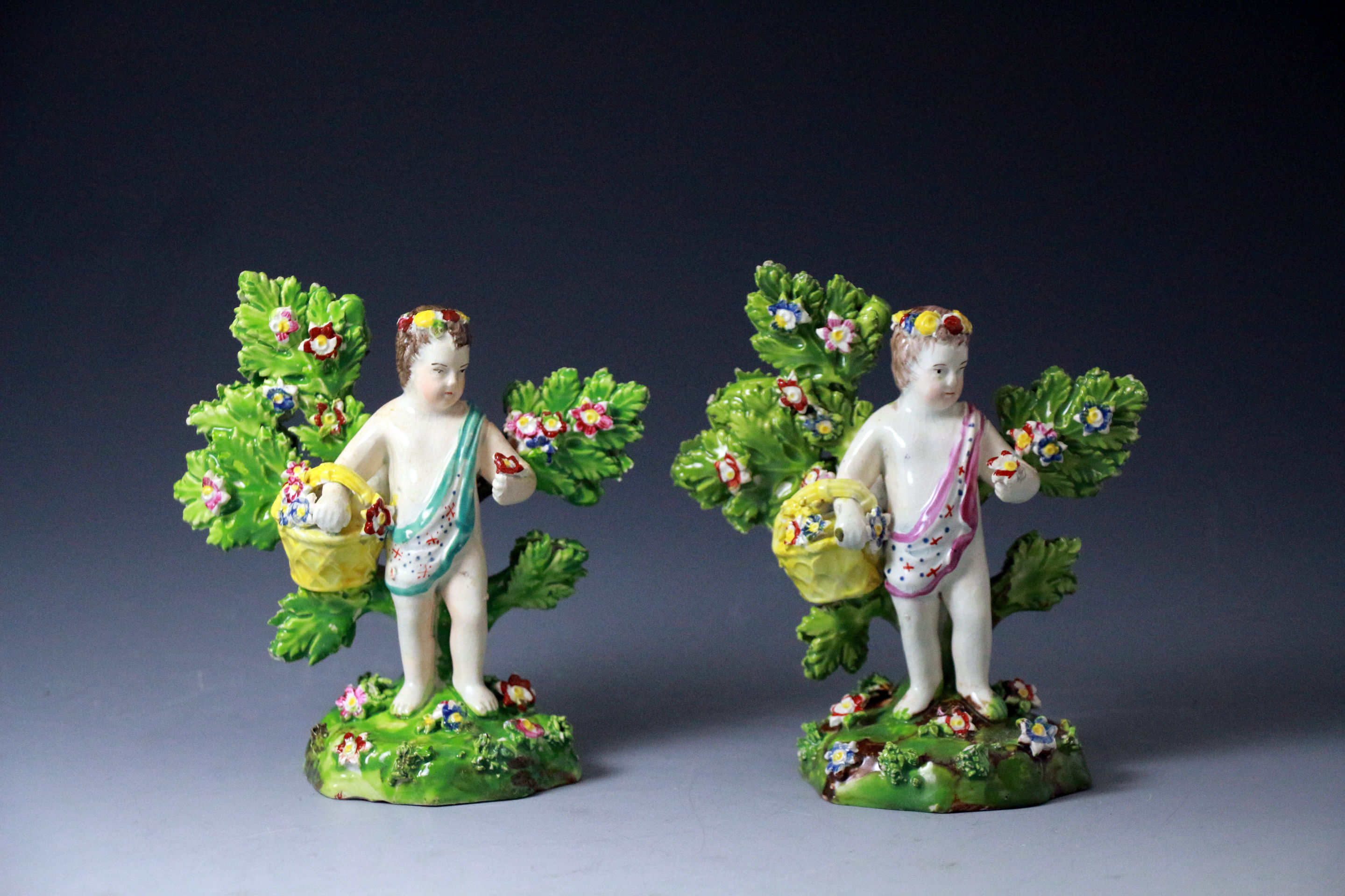 Two Staffordshire pottery pearlware figures of Cherubs by Enoch Wood circa 1820