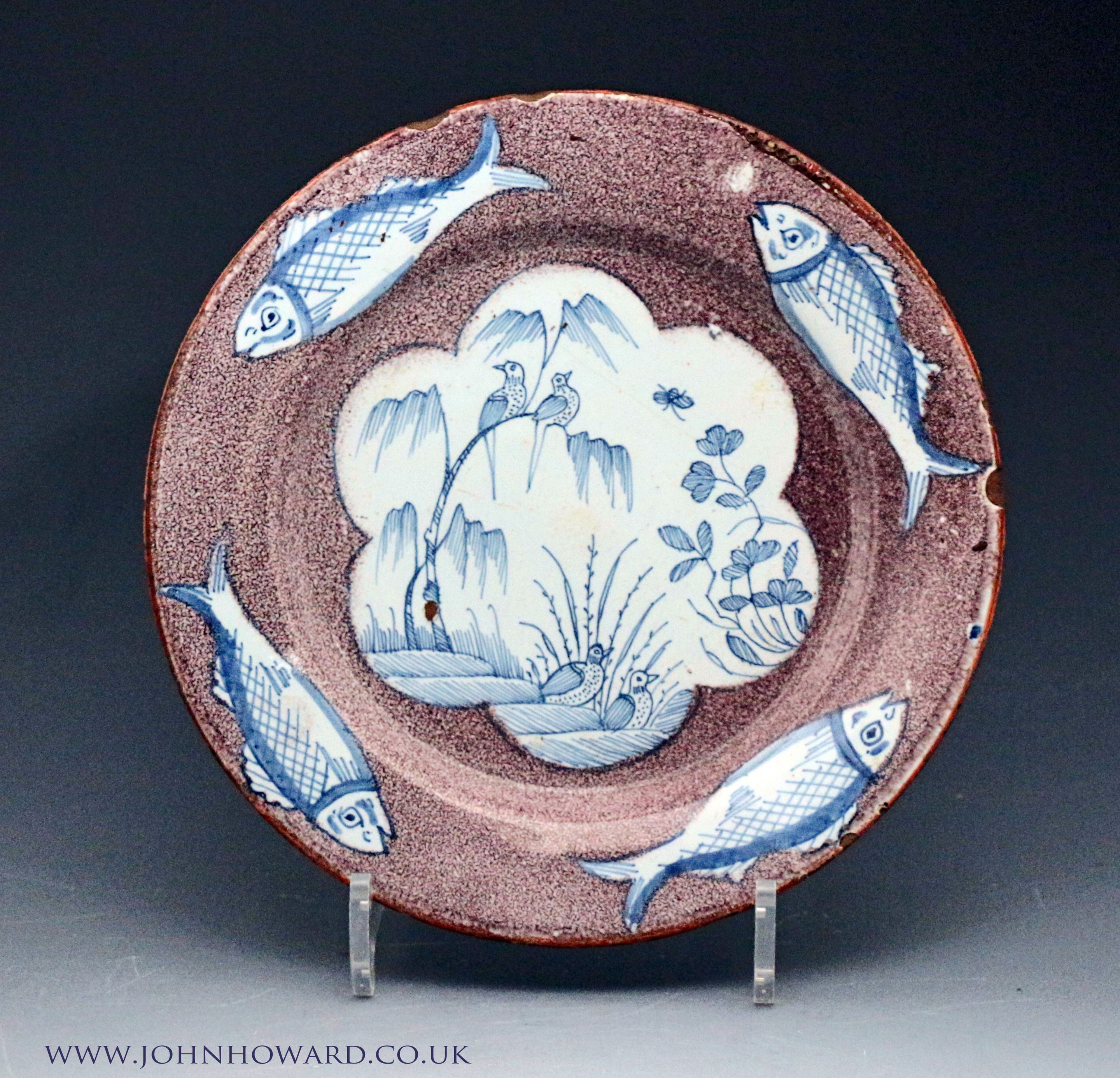 English delftware plate with fish border on manganese ground circa 1735 London.