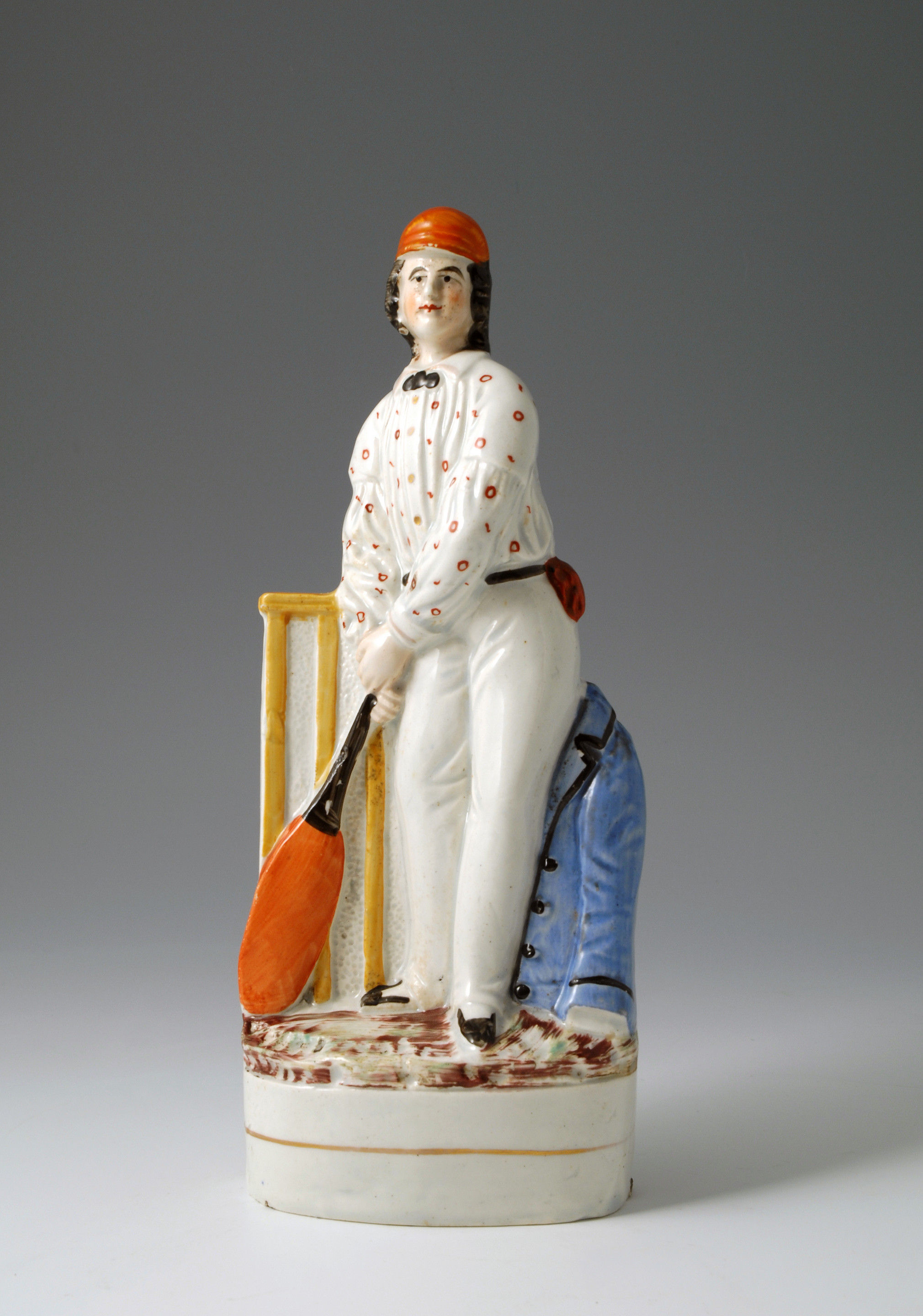 STAFFORDSHIRE POTTERY FIGURE OF A VICTORIAN CRICKET PLAYER